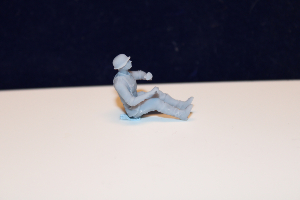 48F004-1 german air force 2 cm quadgun soldier loader sitting on the left side